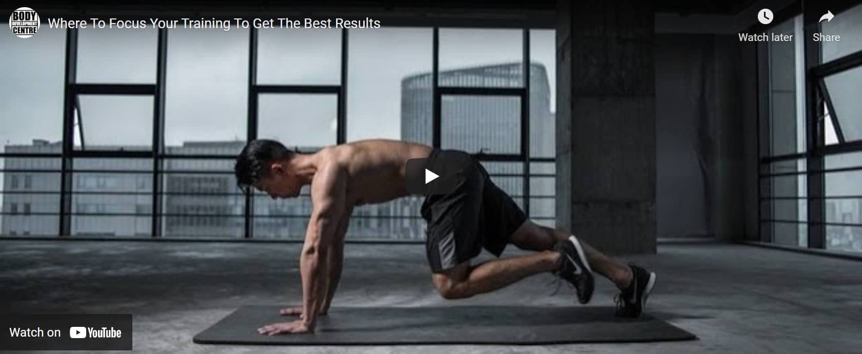 man training indoors on a gym mat