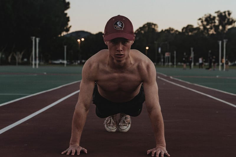 man training on athletics track