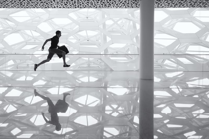 man running with briefcase