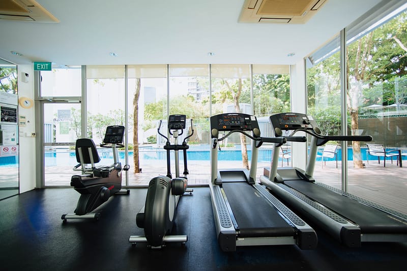 treadmills facing swimming pool